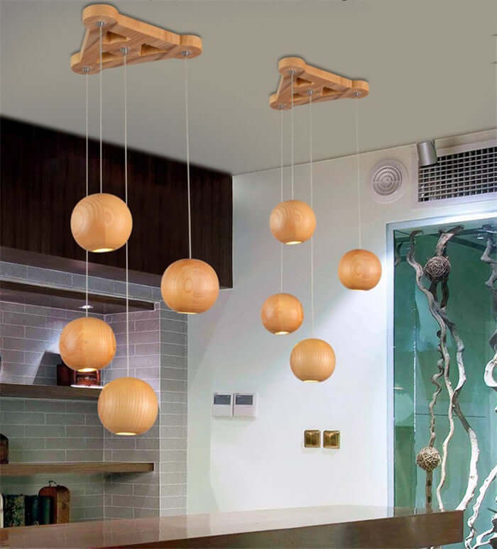 Nordic wood ball chandelier with multiple hanging lamps for modern dining and living room decor.