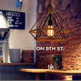 Rustic twine lamp hanging in a restaurant, showcasing industrial style and LED light.